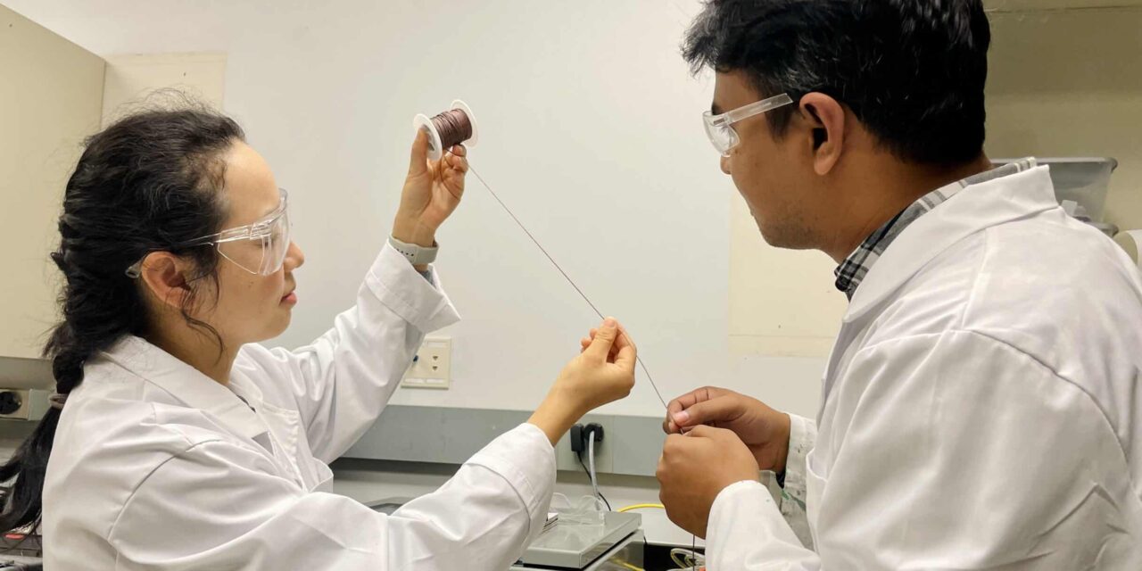 Textile researchers Xiaomeng Fang and Muh Amdadul Hoque are studying artificial muscle fibers. Credit: Akanksha Pragya, NC State.